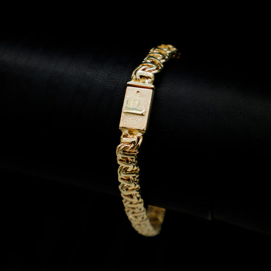 Pulso con inicial en broche tejido guccino 7 mm